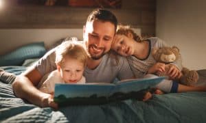 Dad reading to kids before bed Mar2020 | Trio Kids | March, 2023