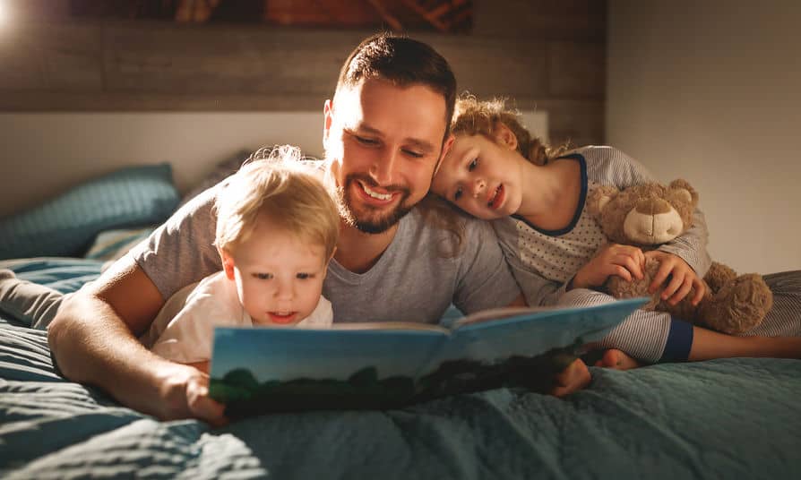Dad reading to kids before bed Mar2020 | Trio Kids | June, 2026